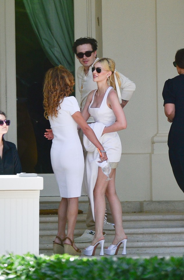 Nicole wore a classy white sundress and silver heels for the brunch the day after the wedding