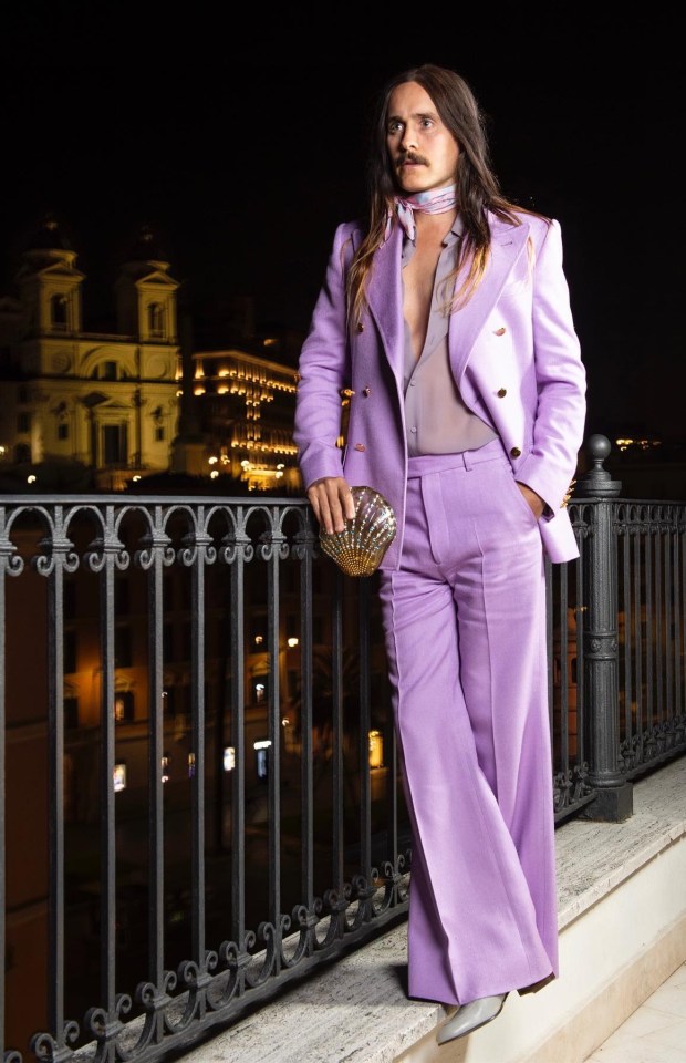 Let's not forget US actor Jared Leto, who enjoys a lilac suit accessorised with a floral scarf and a pretty clutch