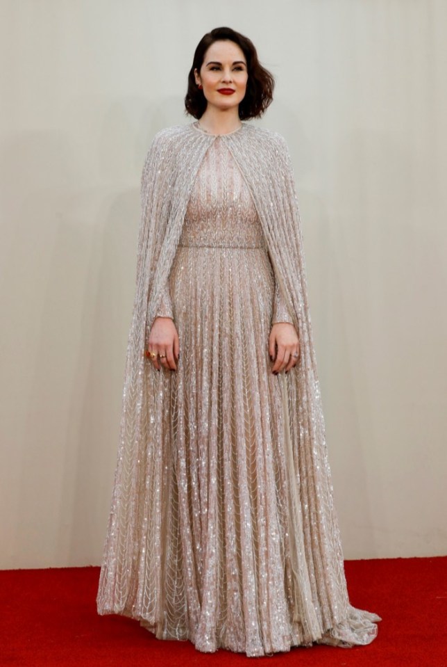 Michelle Dockery glistened in a sensational silver sequinned gown with a matching cape