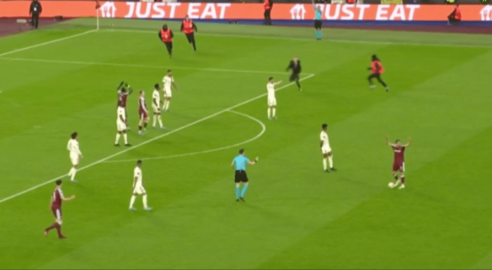 The moment the idiot came onto the pitch with West Ham on the attack