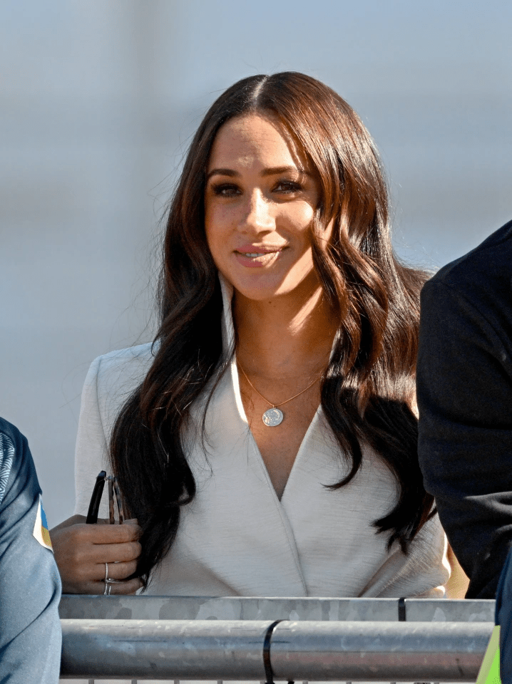 Meghan caught the eye at the Invictus Games in Holland in a stylish £1,944 white blazer by US designer Brandon Maxwell