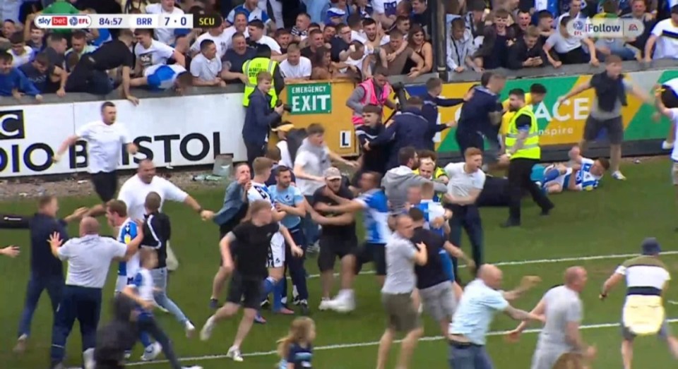 Rovers supporters ran on to the pitch before the referee suspended the match