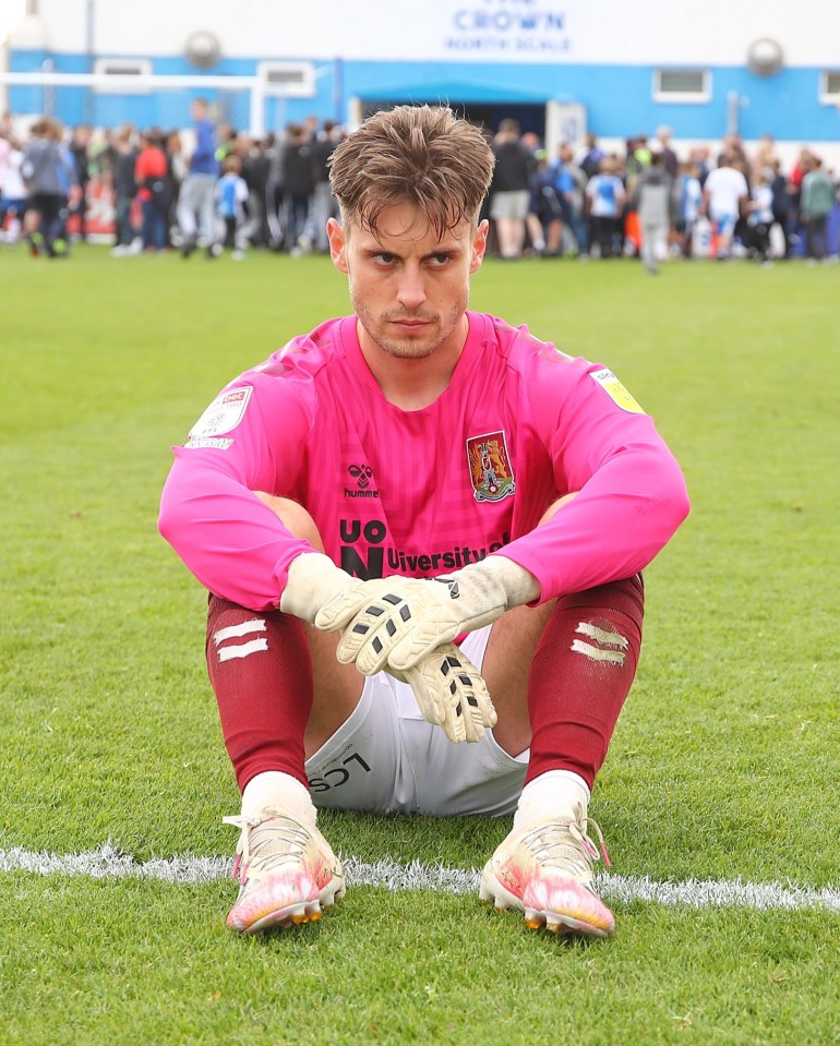 Northampton striker Danny Rose took the goalkeeper gloves but was left dejected despite the 3-1 win