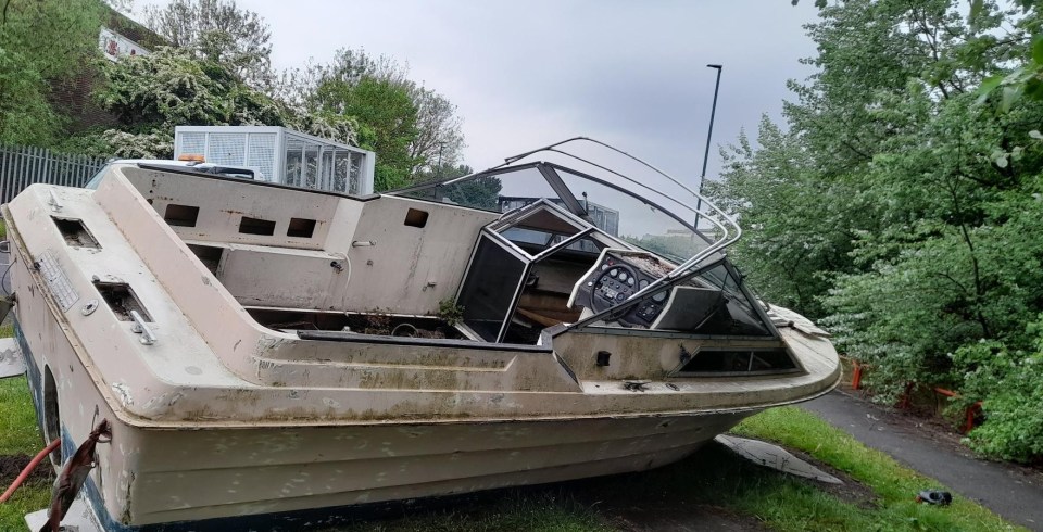 An abandoned boat was left in an industrial estate by fly-tippers