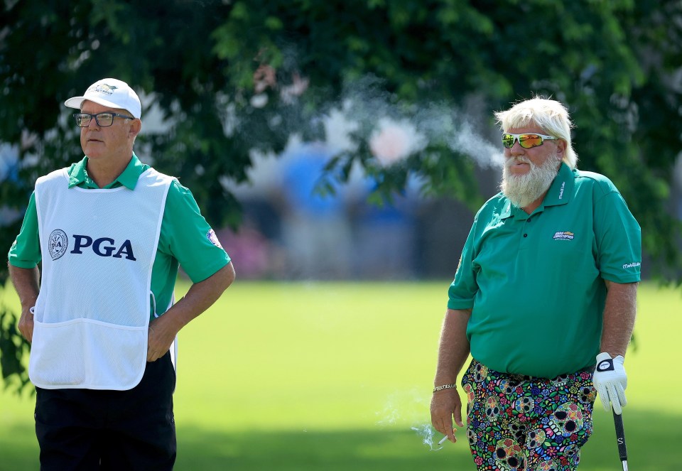 Daly puffed on a cigarette on his way around the course