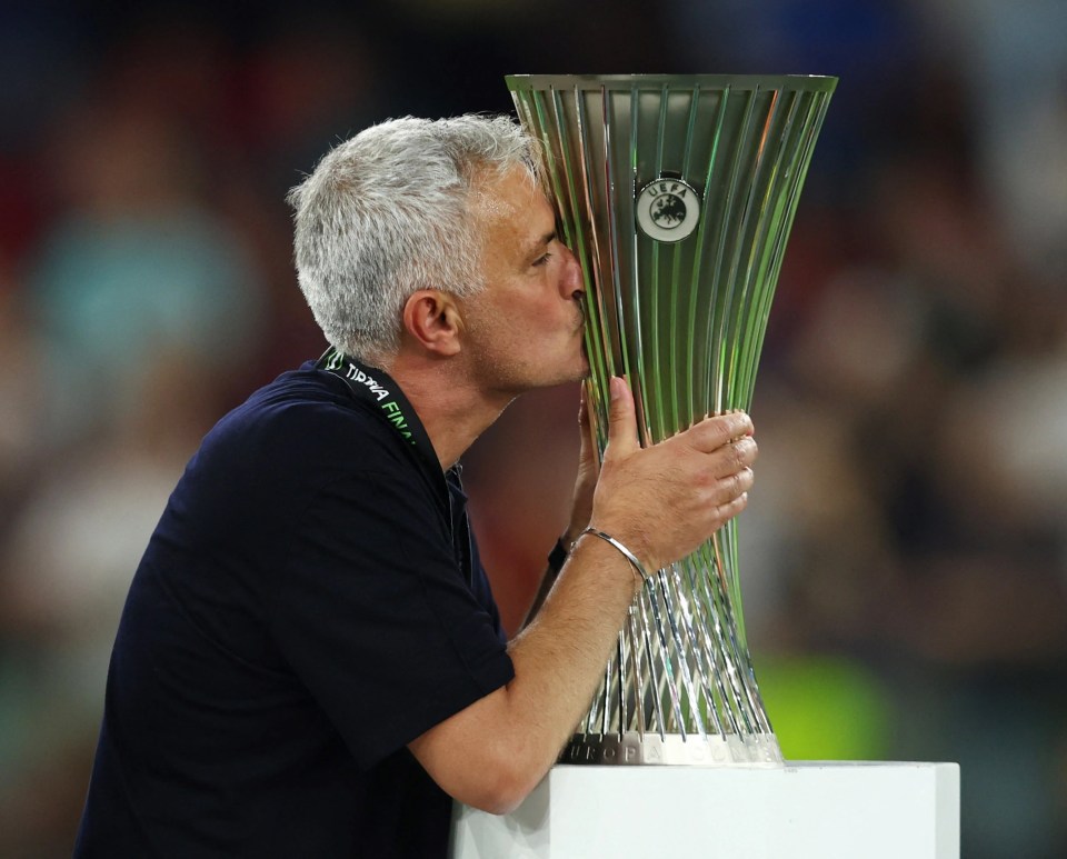 Mourinho could not resist a cheeky kiss of the brand-new trophy