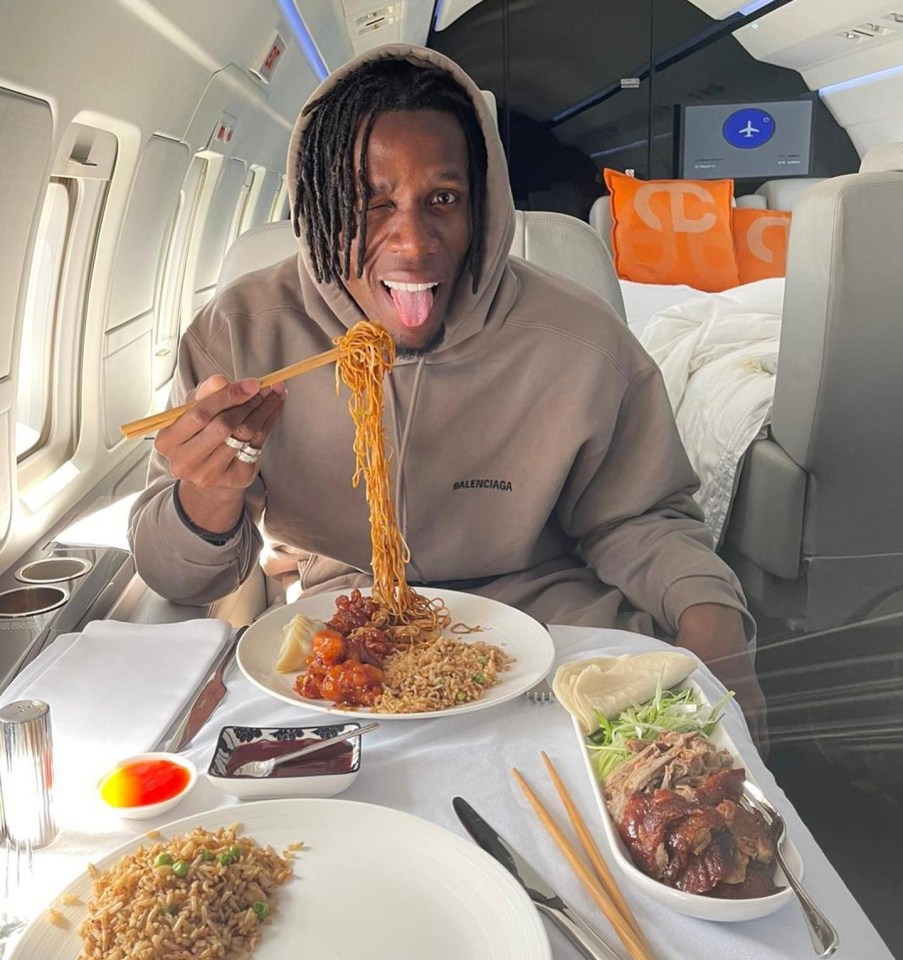 Wilfried Zaha tucked into some Chinese food on his flight