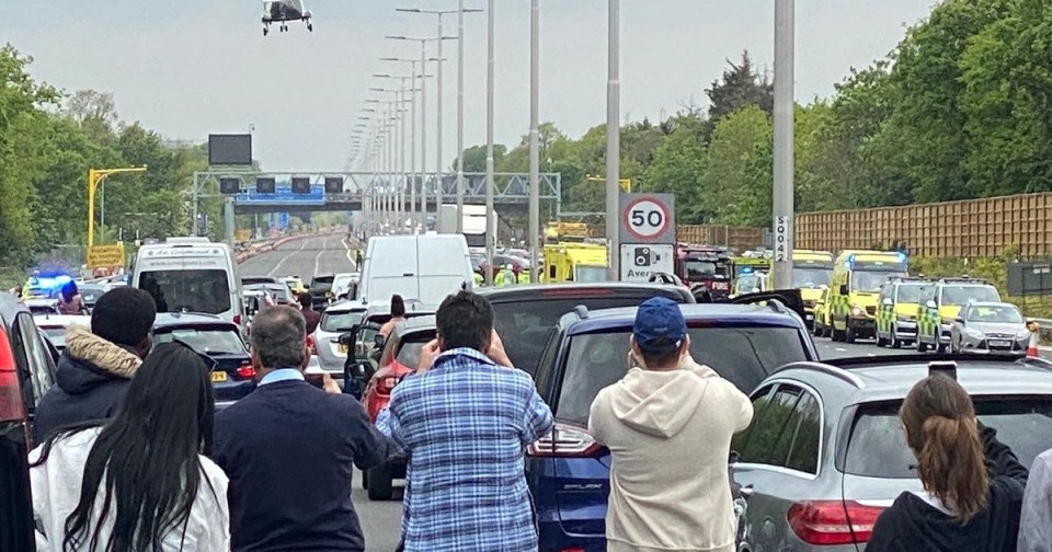 Hundreds stopped to film the helicopter as it airlifted a 10-year-old girl to hospital following a horror smash on the M4 on Sunday