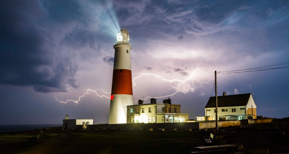 Lightening above the lighthouse at Portland Bill in Dorset