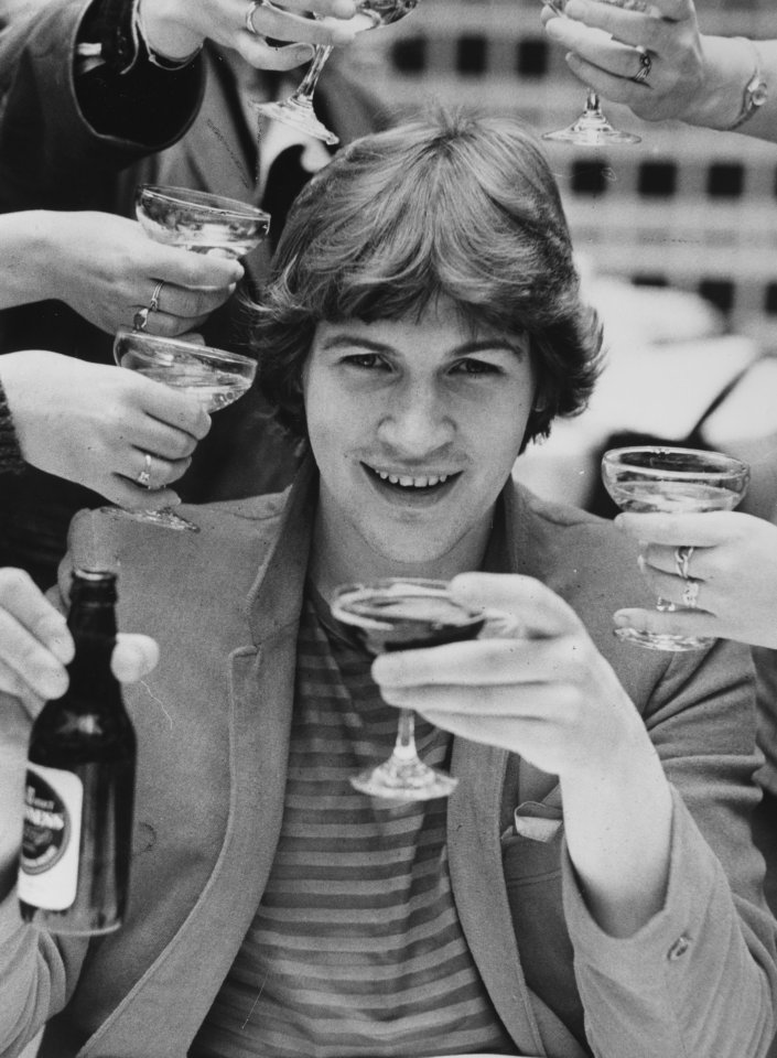 Singer Johnny Logan , Irelands Eurovision Song Winner toasts his win with a champagne glass of Guinness