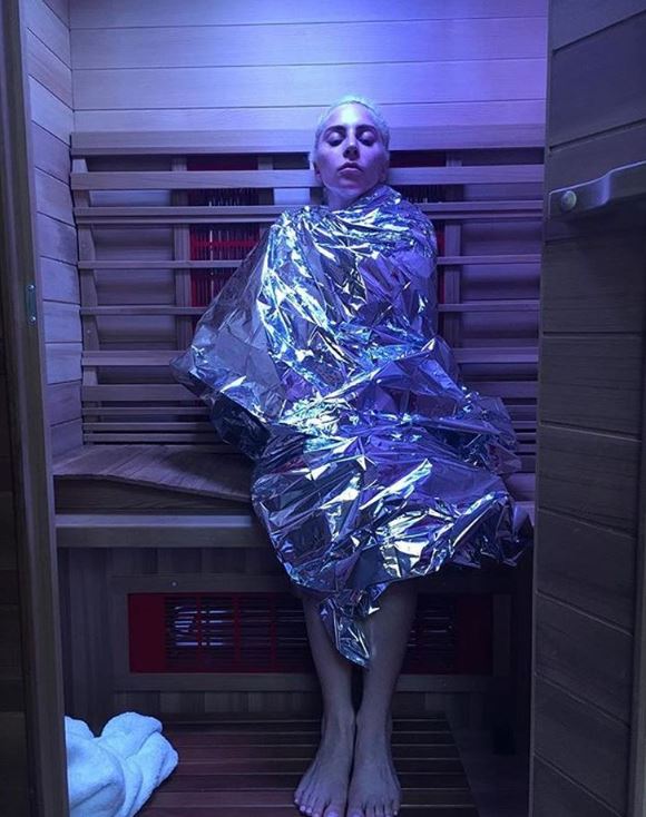 Lady Gaga in an infra-red sauna - which heats the person not the room