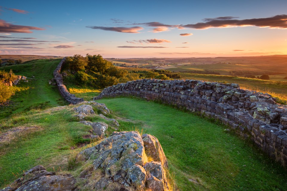 The message was carved into a 16in by 6in stone under the floor of a former barracks at Vindolanda fort near Hexham, Northumberland - pictured Hadrian's Wall