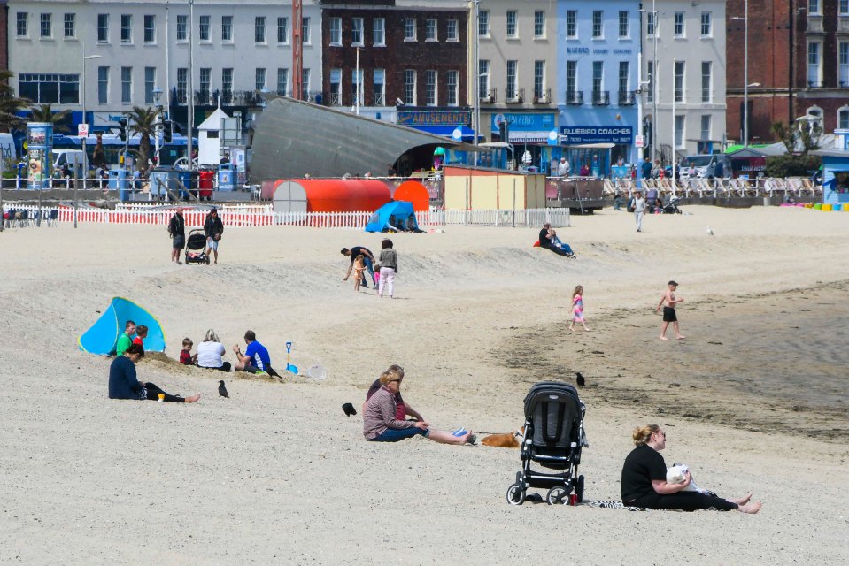 Families enjoyed the warm weather at the beach in Weymouth, Dorset, on Friday