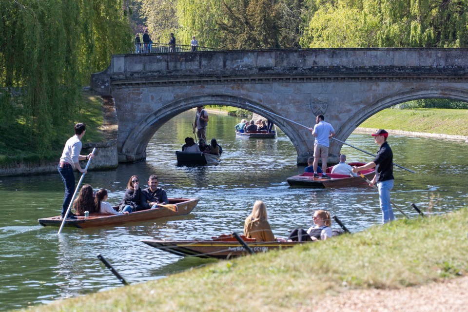 People enjoying the warm weather out punting on the River Cam in Cambridge