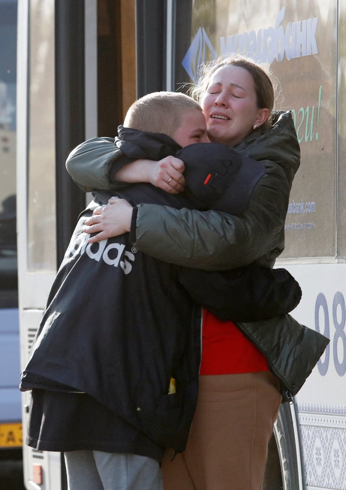 Azovstal steel plant employee Valeria hugs her son Matvey