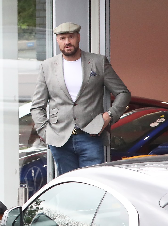 Tyson Fury was spotted at a Cheshire car dealership trading in his Ferrari for an all-electric Porsche