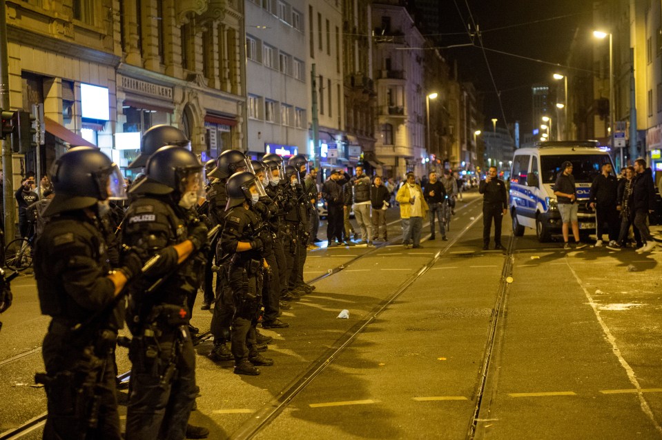 Riot police were called in to protect West Ham fans from Frankfurt thugs last night