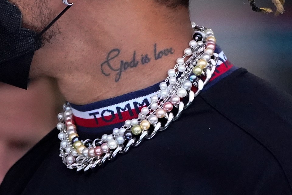 Lewis Hamilton turned up to the press conference wearing four necklaces