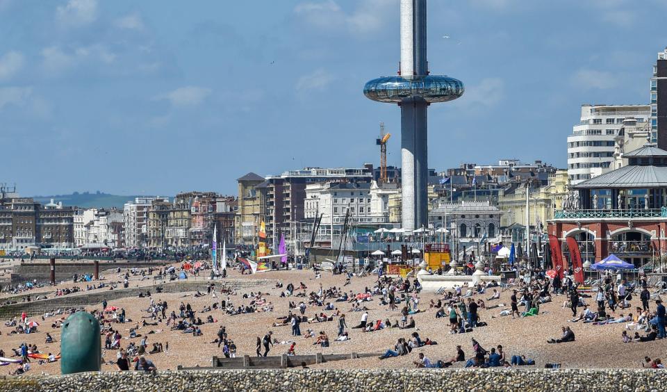 Brighton beach was heaving with crowds in the hot weather at lunchtime today