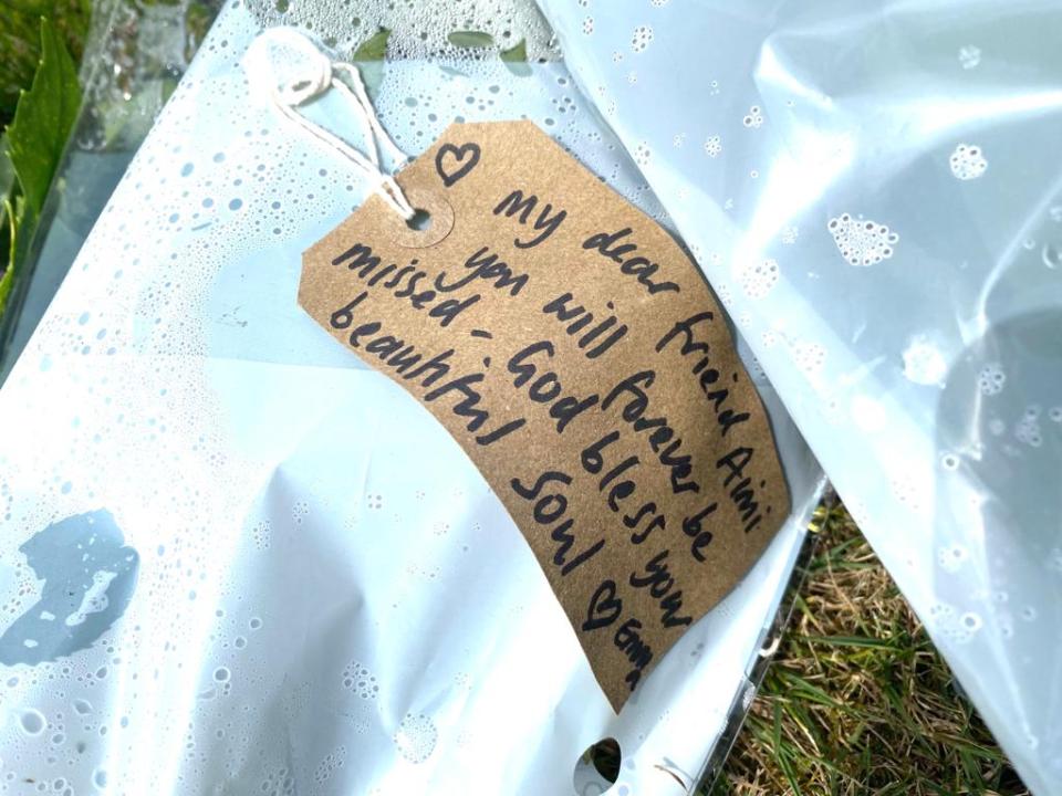 Flowers bearing heart-wrenching messages have been left at the scene