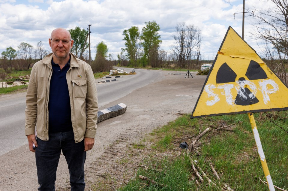 Sun man Nick Parker at the Chernobyl disaster site where Russian soldiers have been said to have 'dug their own graves'