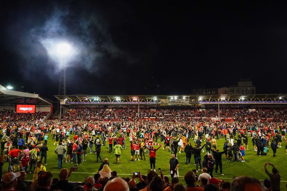 Thousands of fans ran onto the City Ground pitch to celebrate Nottingham Forest reaching the Championship play-off final at Wembley