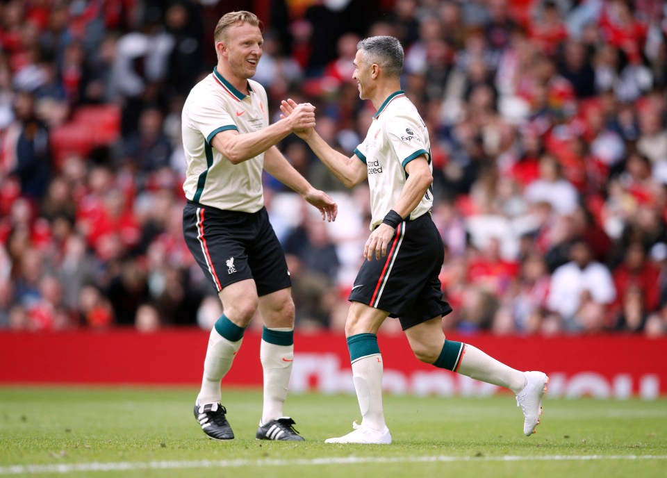 Dirk Kuyt celebrates with the impressive Spaniard