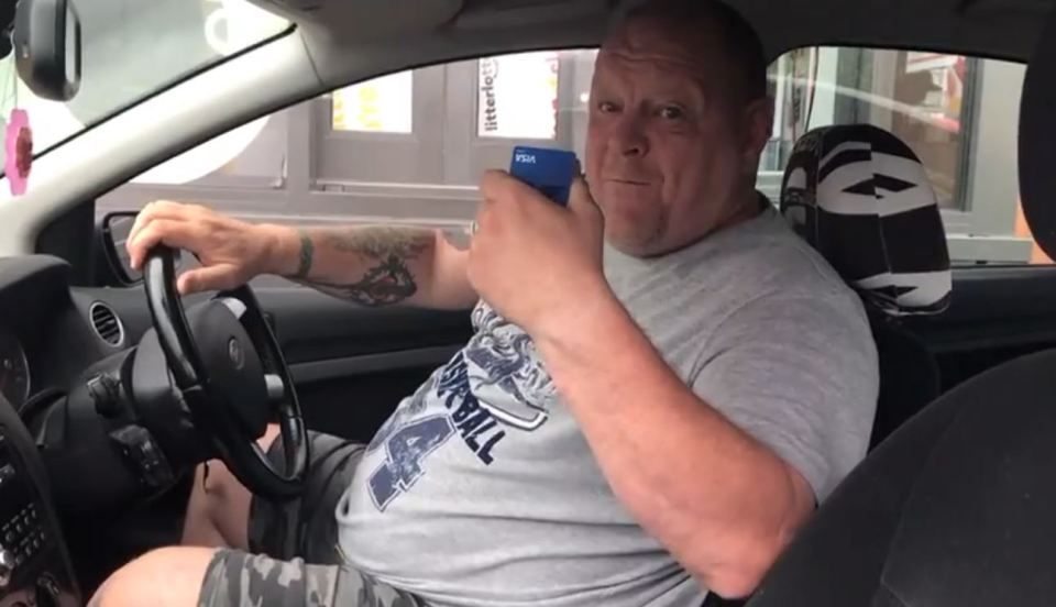 Stuart Yates, 55, in his car while blockading a McDonald's drive-thru