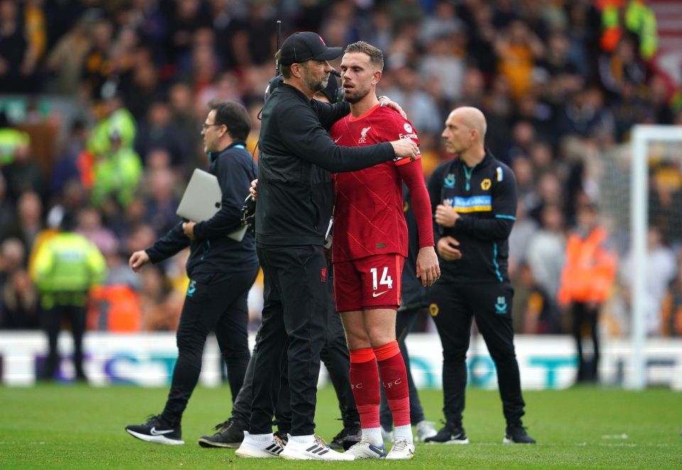 Liverpool manager Jurgen Klopp and Jordan Henderson show their dejection after a 3-1 win over Wolves failed to stop Man City winning the title