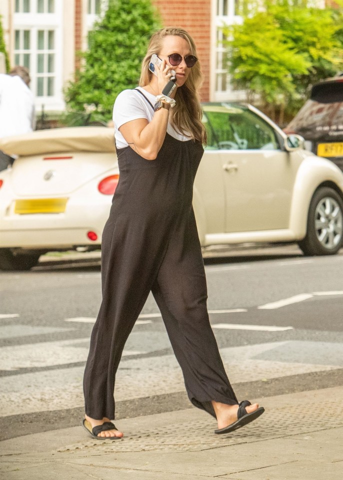 Chloe looked cool in dungarees and sandals