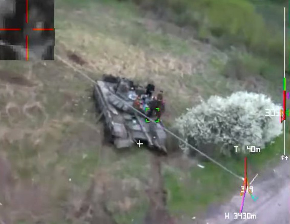 Footage shows a Ukrainian kamikaze drone smash into Russian tank