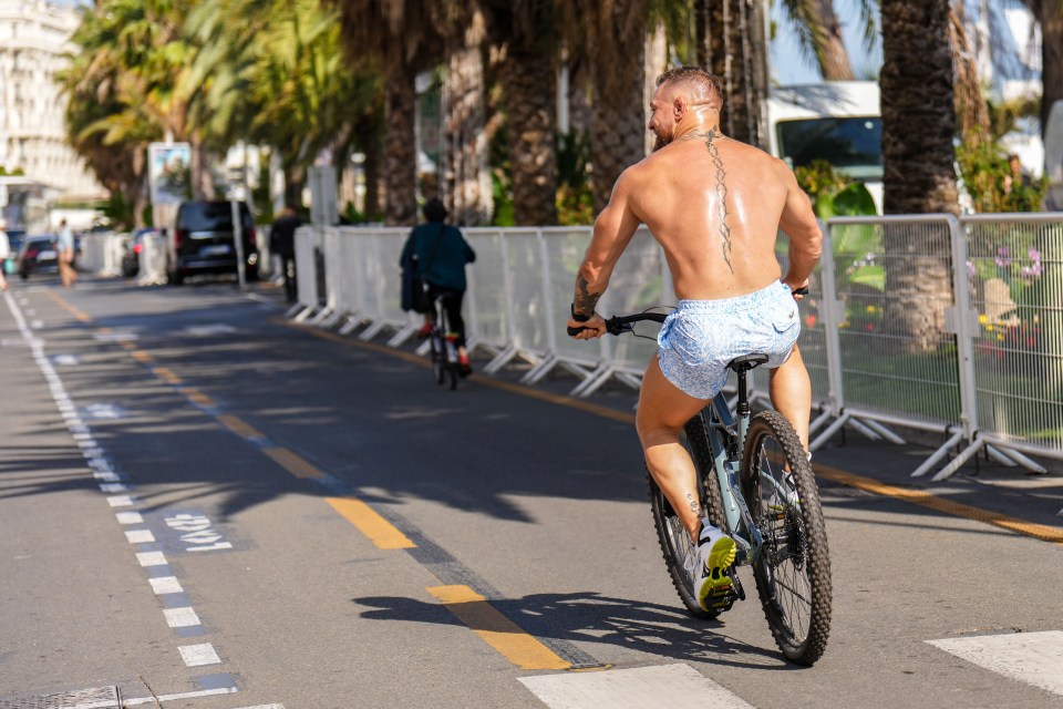 The UFC fighter enjoyed a bike ride in the sun before heading to the premiere