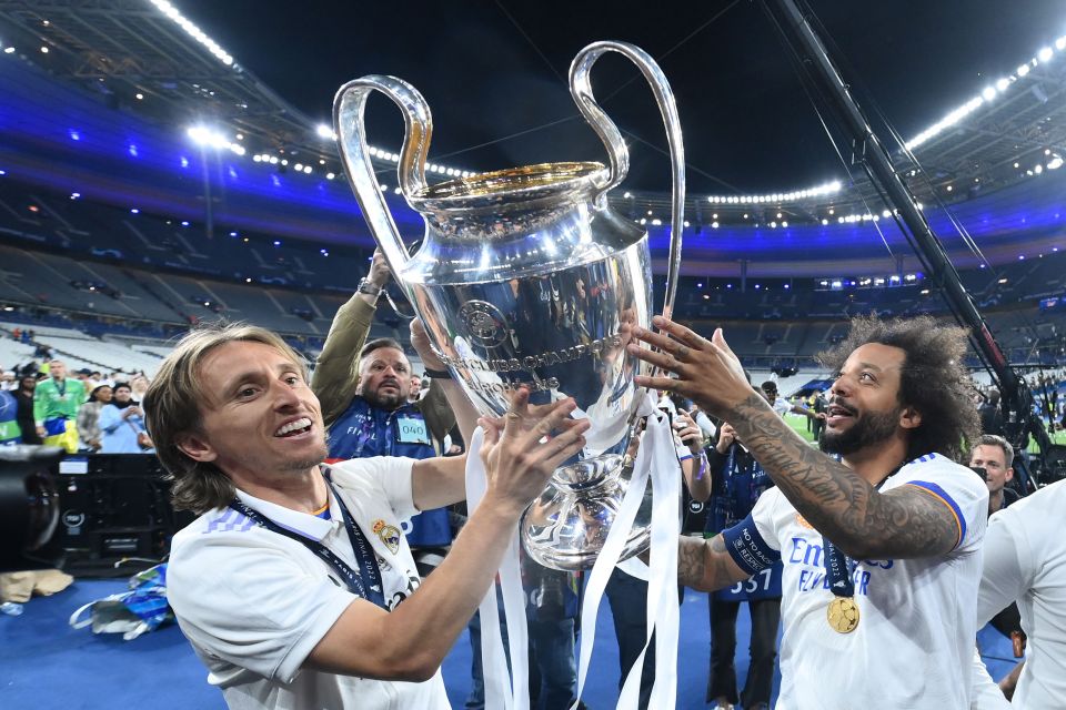 Modric, left, and Marcelo lift their fifth Champions League trophy