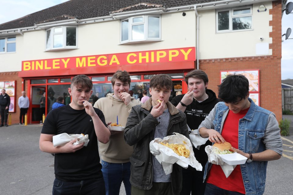 Youngsters chow down on fish and chips and burgers outside Binley Mega Chippy