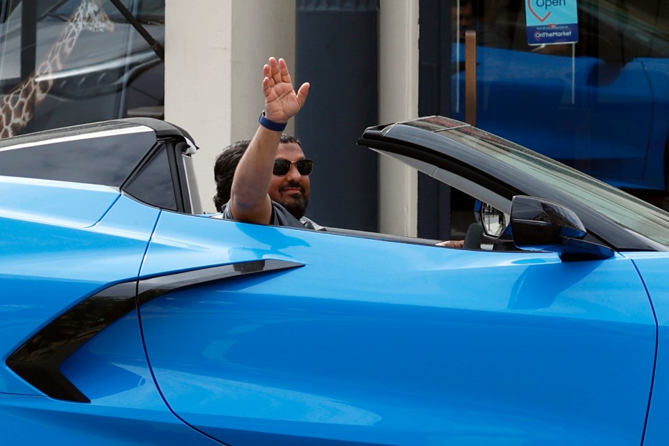 Hamed waved at fans out of the £120,000 supercar