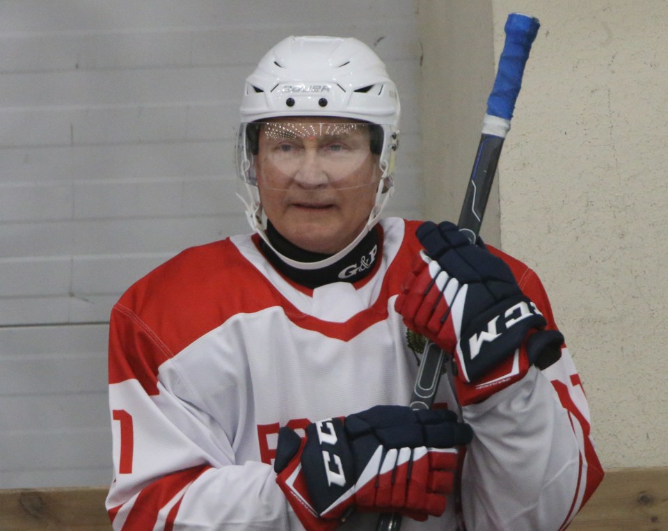 2021: The Russian president is almost unrecognisable in a pic from an ice hockey match