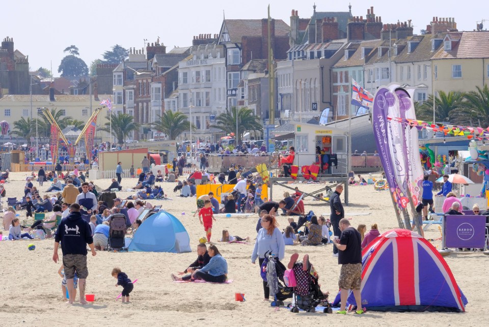 Visitors enjoy a sunny but cool day at Weymouth, Dorset