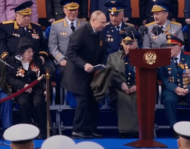 Vlad scoops it up and sits down before his speech