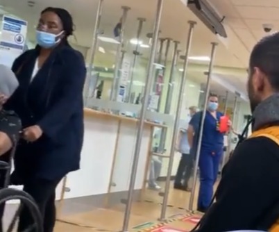 Patients are relatives can be seen walking round the hospital while the nurse informs everyone who is waiting that they will be there for a while