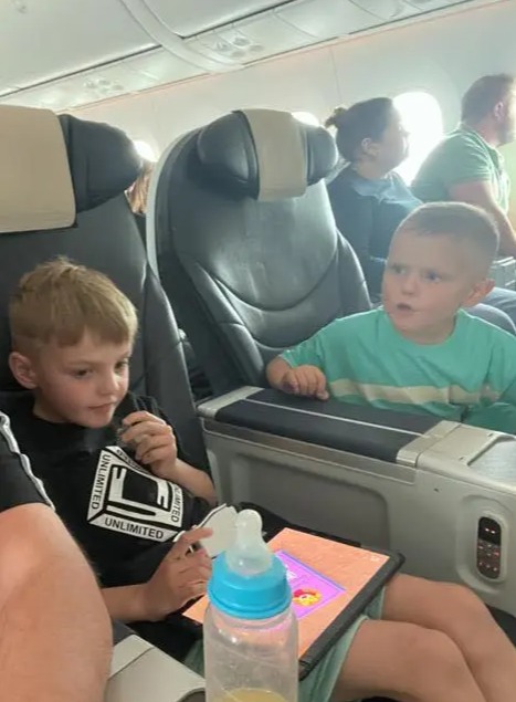 Little Billy and his brother sitting in premium economy on their TUI flight