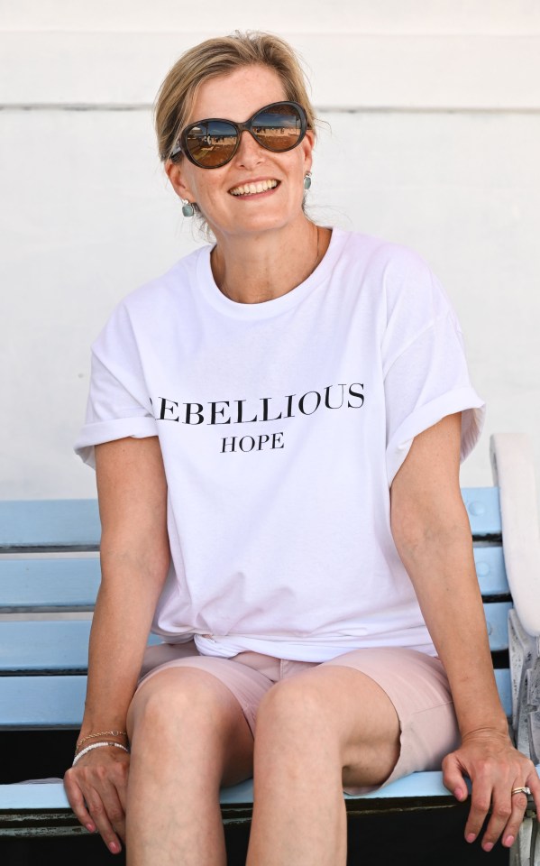 Sophie sported the white 'Rebellious Hope' t-shirt as she joined hubby Edward at the beach