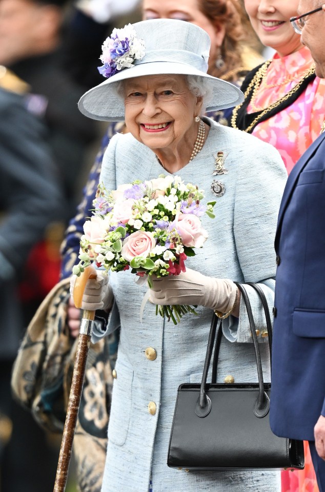 The Queen beamed as she stood without using her trusty stick