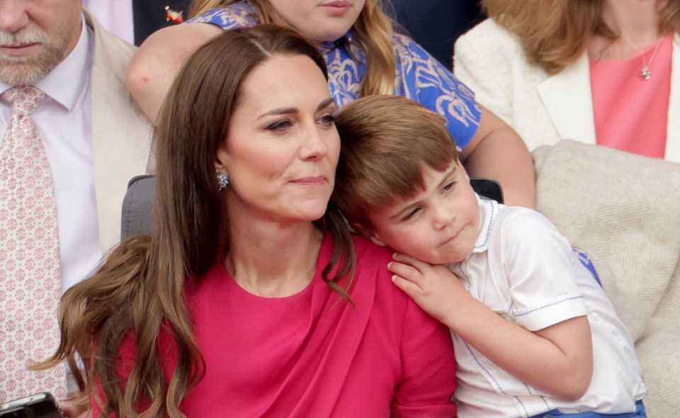 Louis cuddled up to mum Kate during the pageant