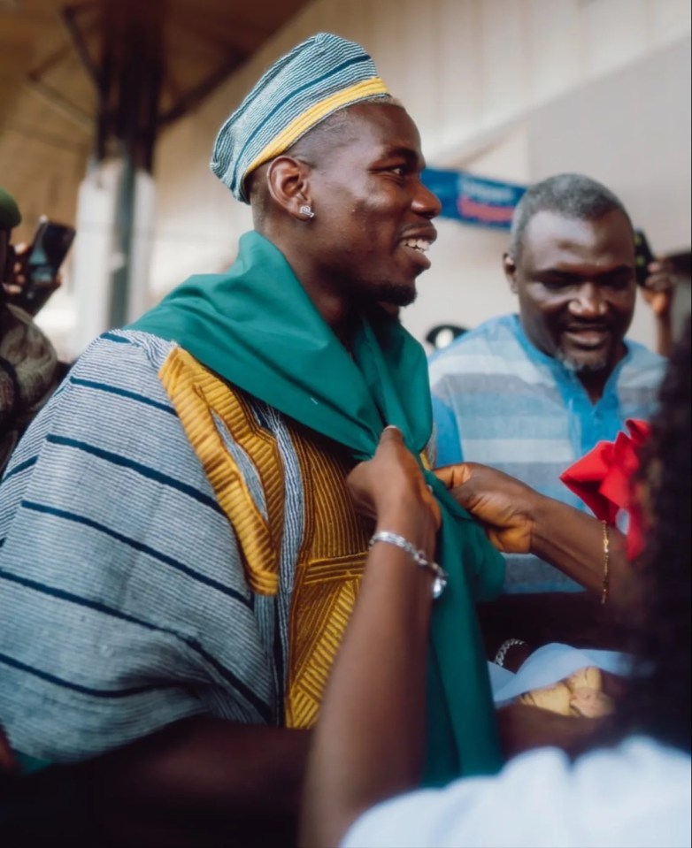 Paul Pogba was mobbed as he arrived in Guinea ahead of an upcoming charity match