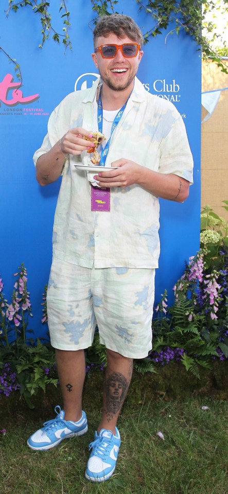 Roman Kemp tucking into a croissant burger at Taste of London