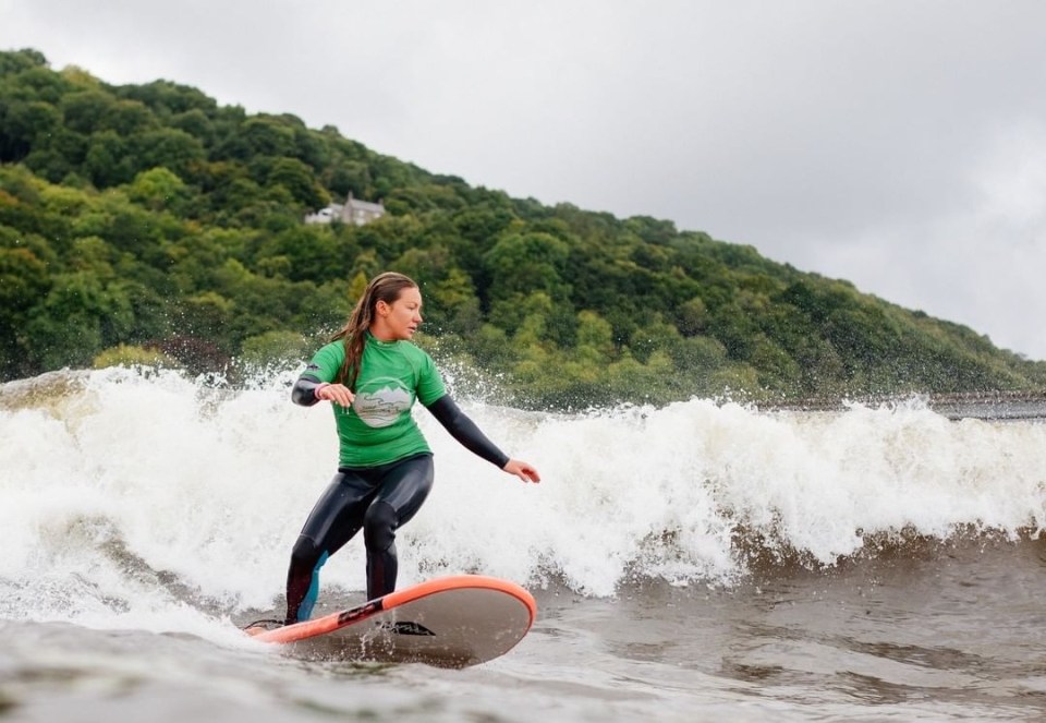 A surfer rides a wave at the Adventure Parc lagoon