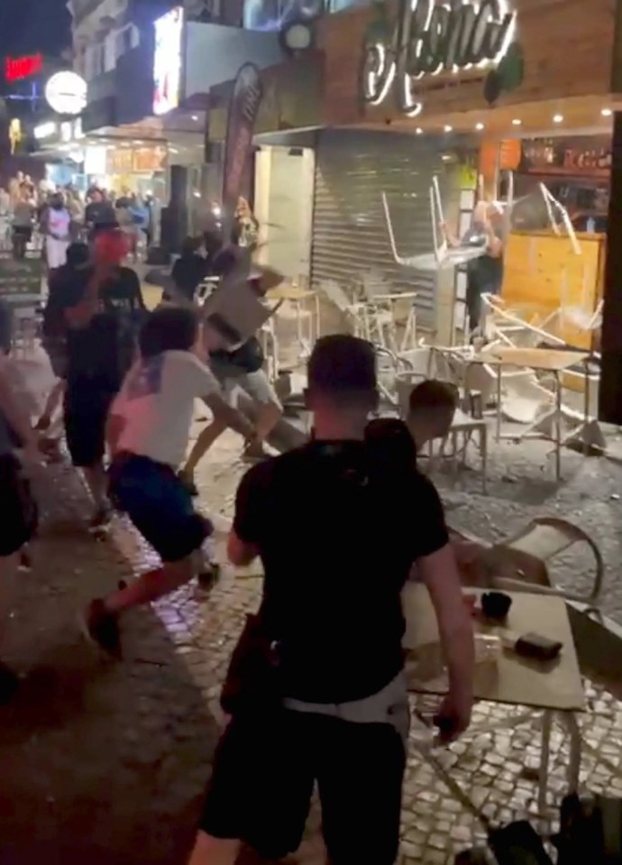 The staff tried to shield themselves from the flying furniture with tables