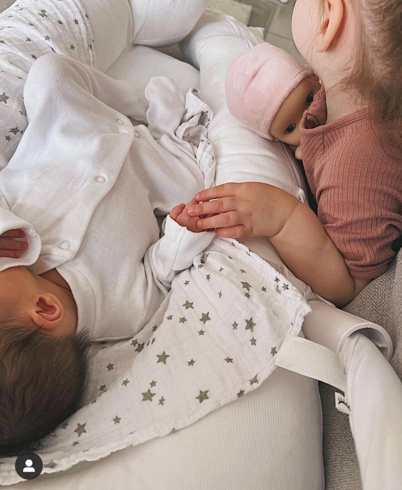 She shared an adorable snap of the tot sleeping next to her eldest daughter Raine Anais