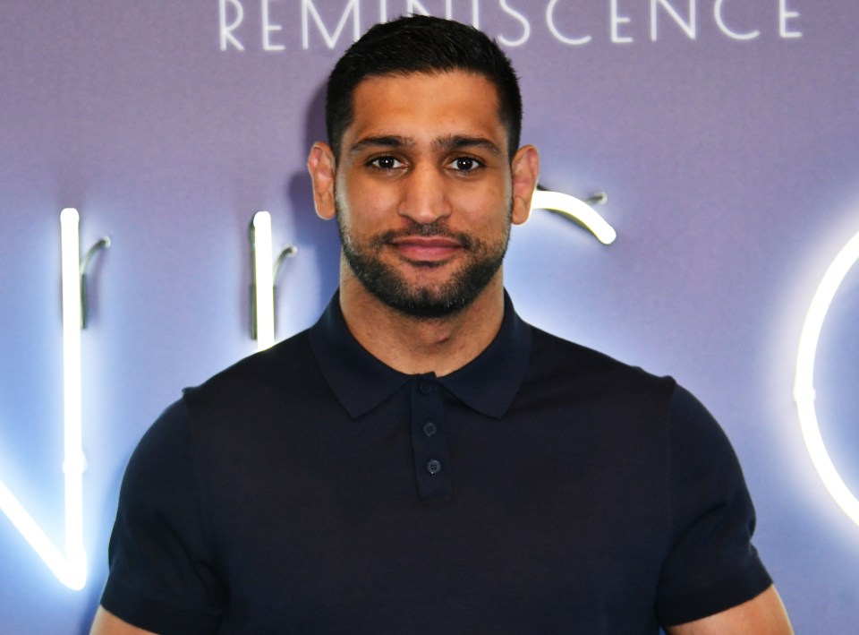 Three men have been arrested after Amir Khan was robbed of his watch at gunpoint in April