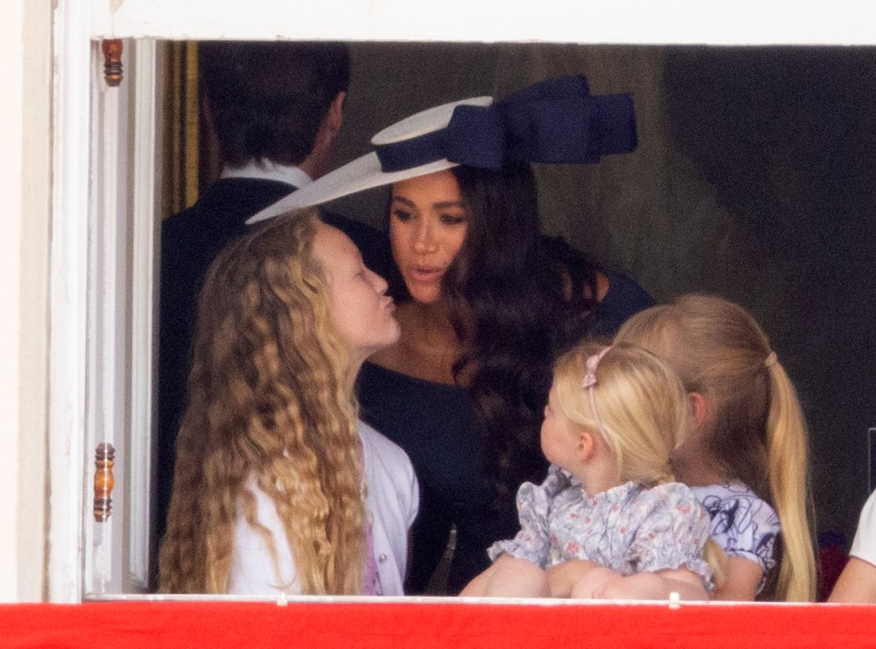 Meghan joined in on Thursday's engagements - but she and Harry were not on the royal balcony